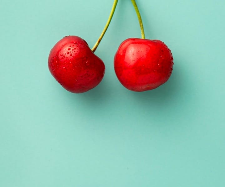 a cherry on a blue background